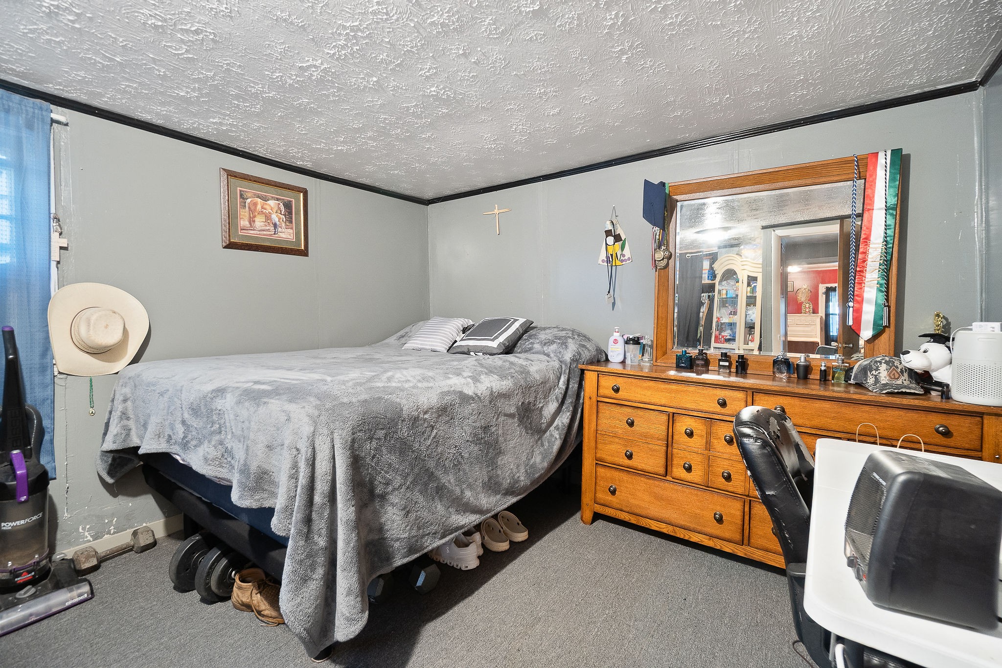 2184 Hyder Mountain Road Cookeville, TN 38506 - Photo 15 of 33 a spacious bedroom with a bed and a chandelier