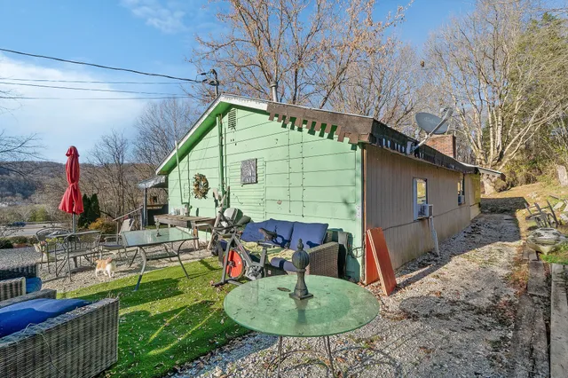 a view of house with backyard