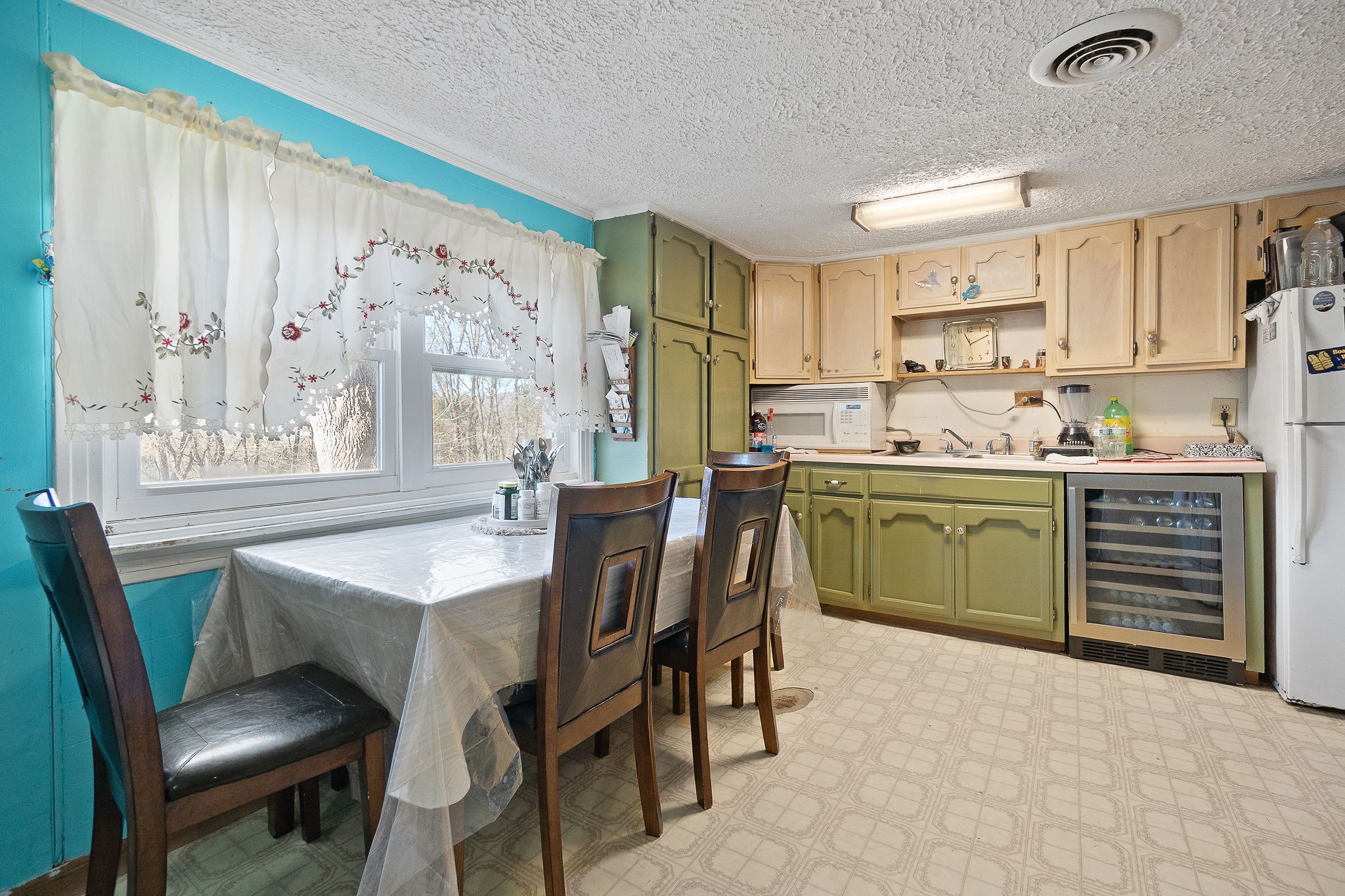 2184 Hyder Mountain Road Cookeville, TN 38506 - Photo 9 of 33 a kitchen with a table chairs sink and cabinets