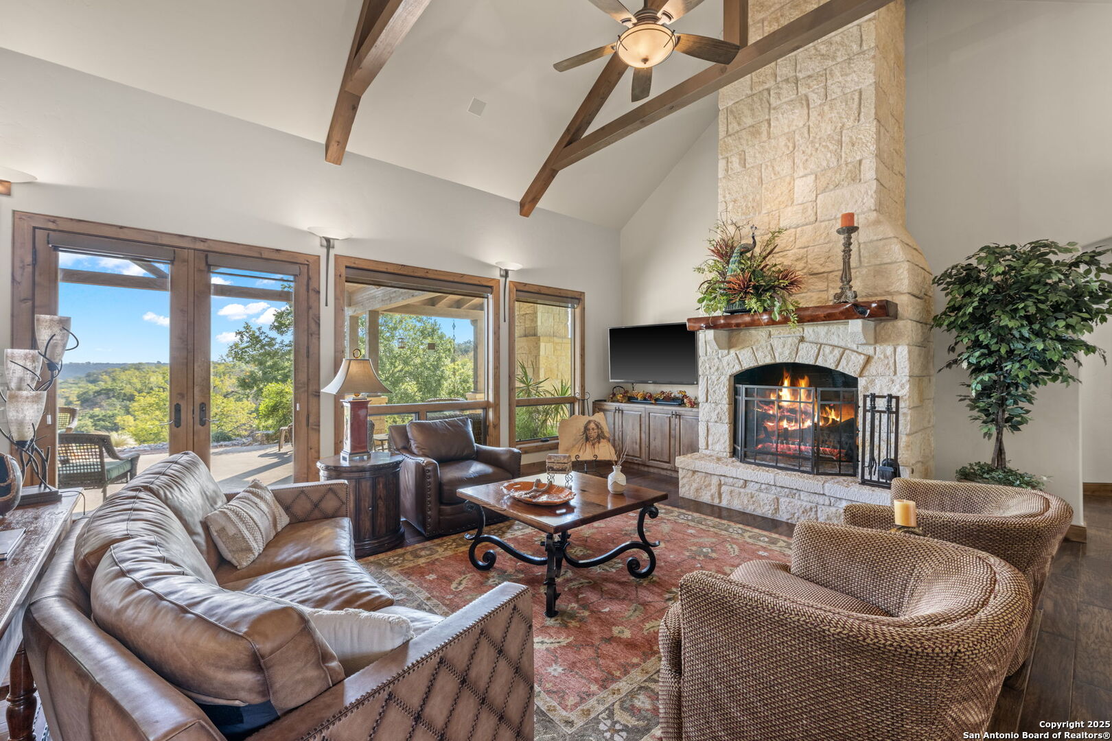 131 Bootlegger Lane North Kerrville, TX 78028 - Photo 11 of 50 a living room with furniture fireplace and a large window