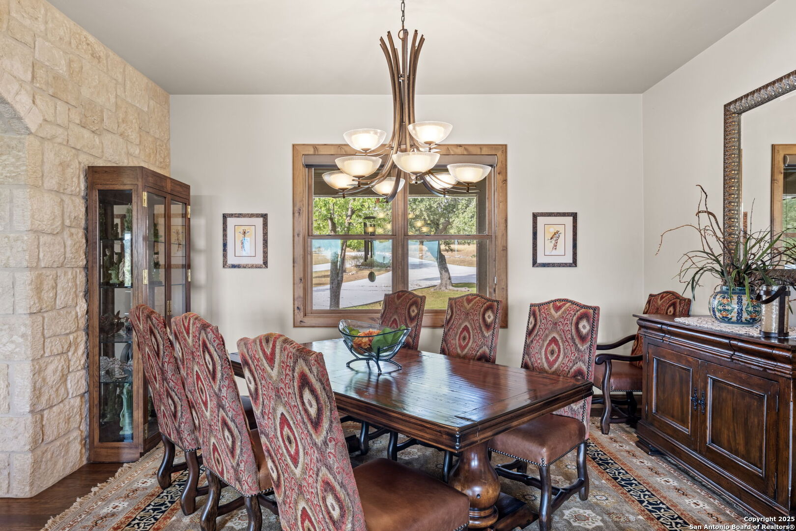 131 Bootlegger Lane North Kerrville, TX 78028 - Photo 14 of 50 a view of a dining room with furniture window and wooden floor
