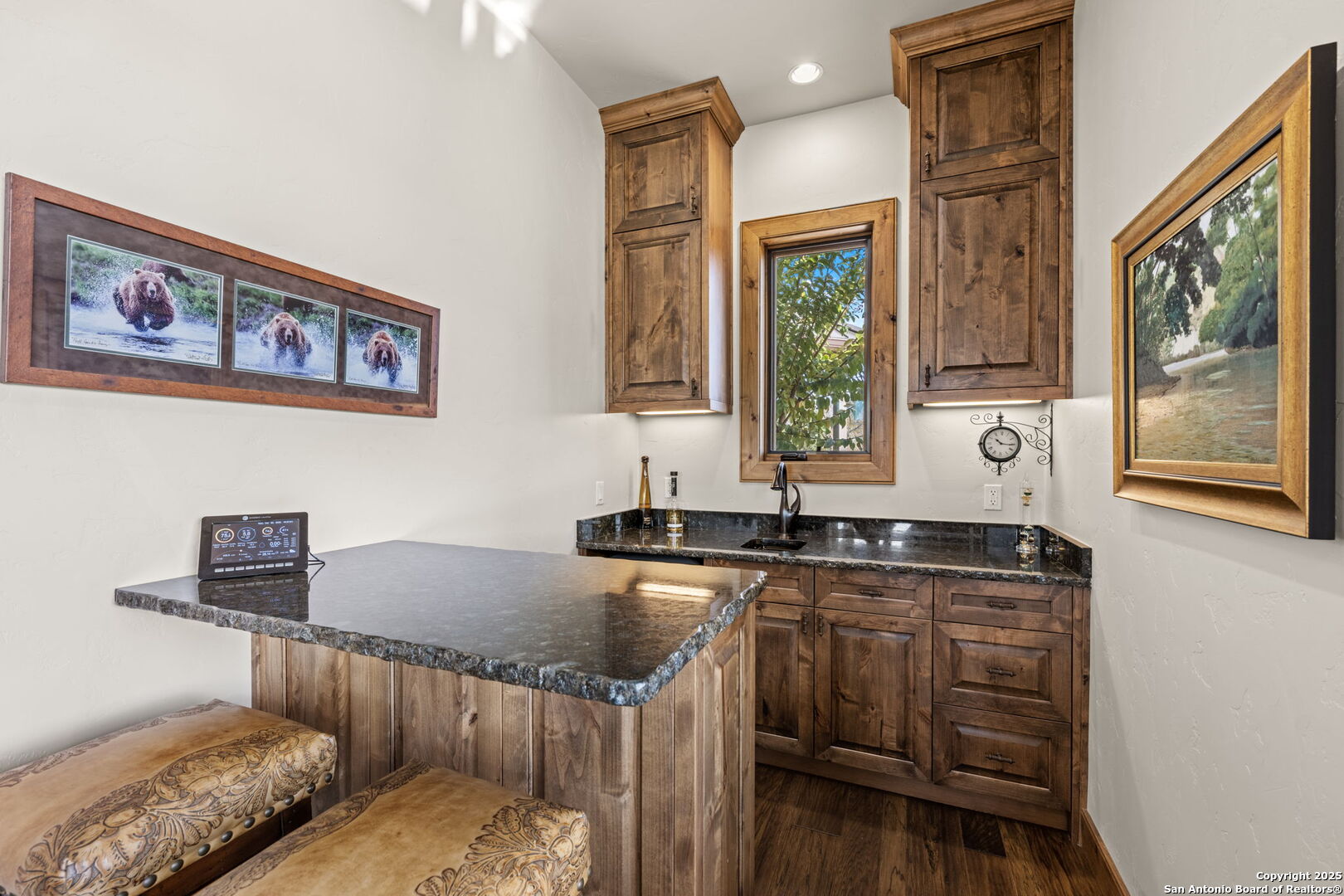131 Bootlegger Lane North Kerrville, TX 78028 - Photo 17 of 50 a kitchen with granite countertop a stove a sink and a microwave