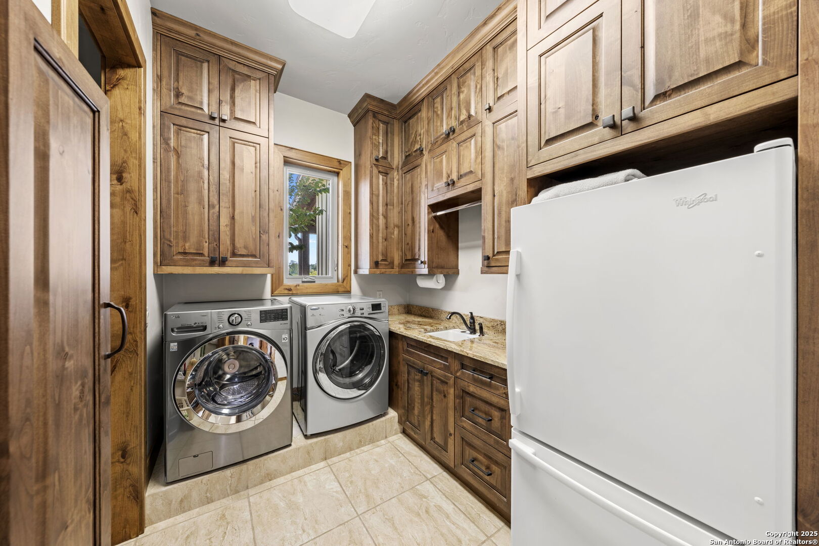 131 Bootlegger Lane North Kerrville, TX 78028 - Photo 23 of 50 a utility room with dryer and washer