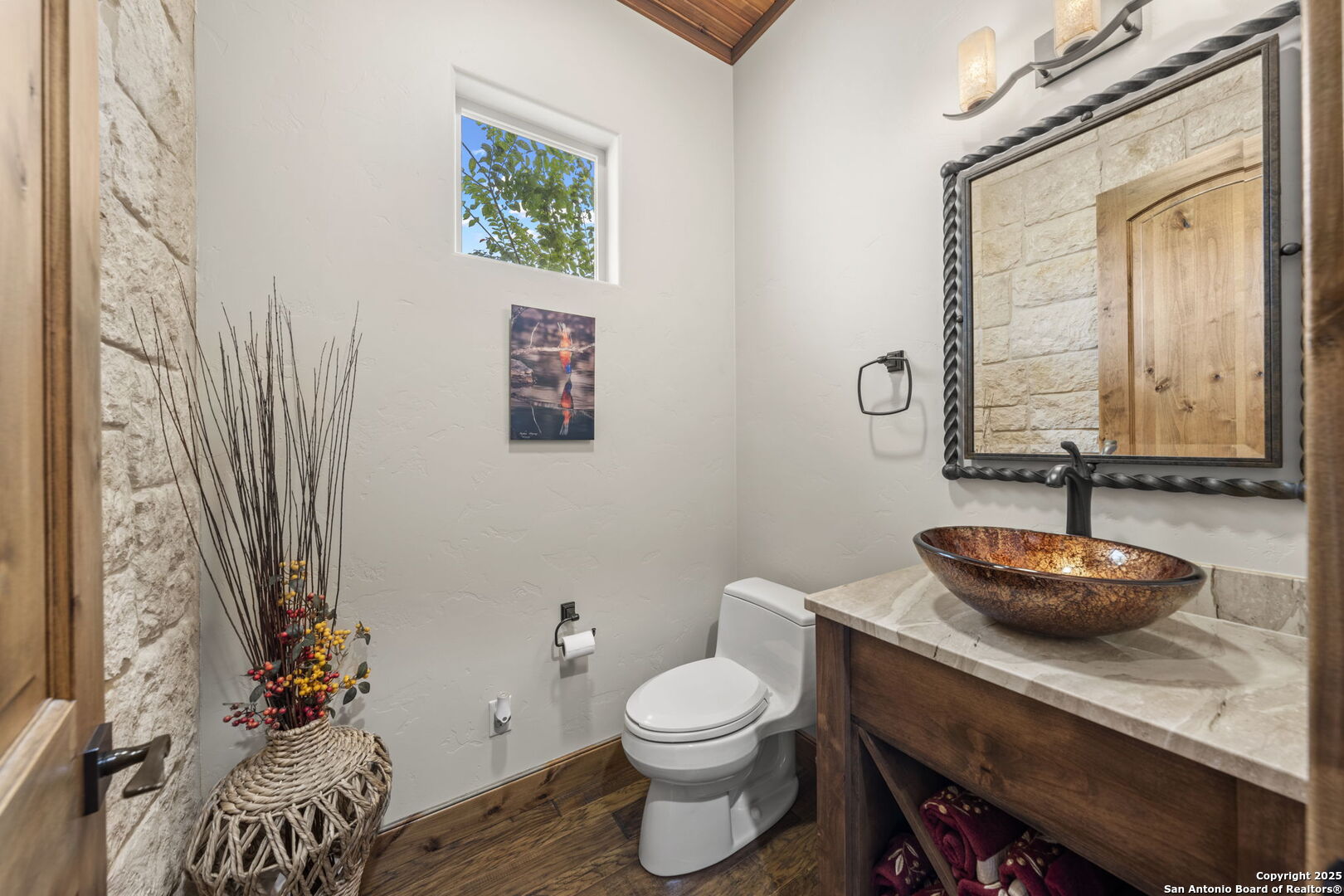 131 Bootlegger Lane North Kerrville, TX 78028 - Photo 25 of 50 a bathroom with a granite countertop toilet and a sink