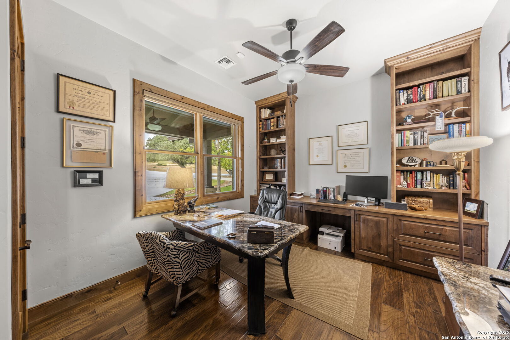 131 Bootlegger Lane North Kerrville, TX 78028 - Photo 26 of 50 a view of a workspace with furniture and a window