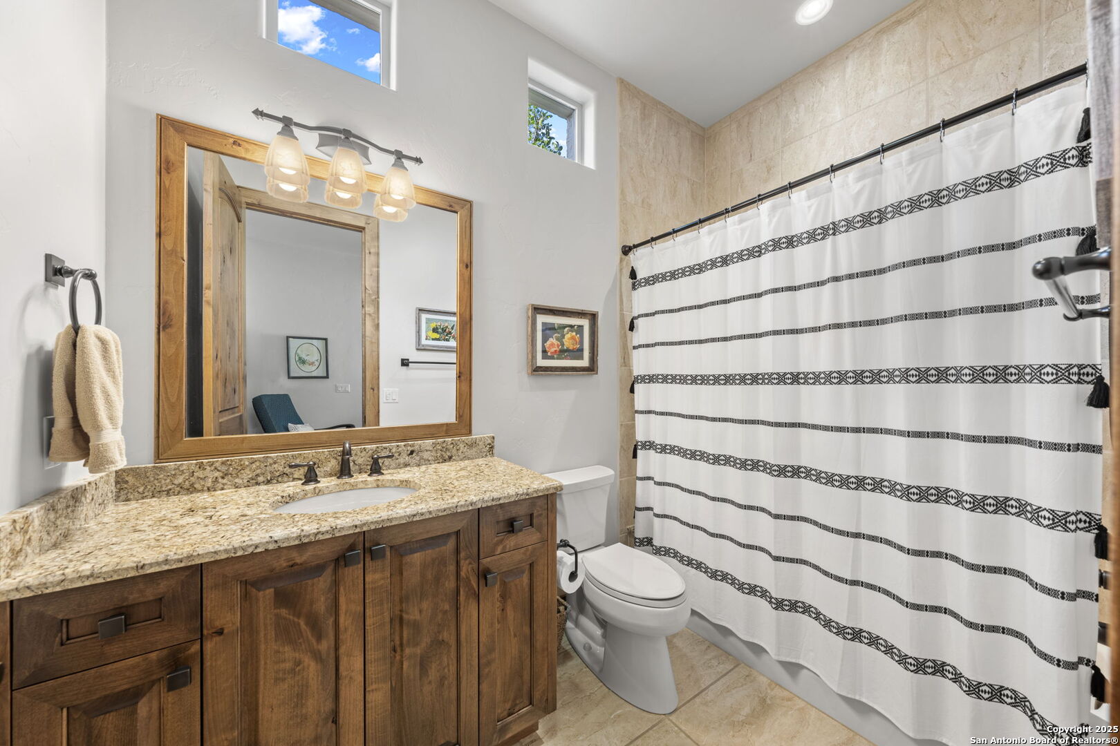 131 Bootlegger Lane North Kerrville, TX 78028 - Photo 29 of 50 a bathroom with a granite countertop sink toilet and shower