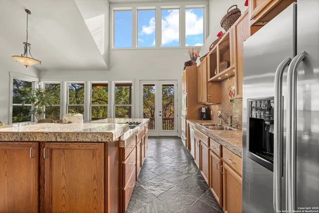 a view of a dining room with furniture large windows and wooden floor