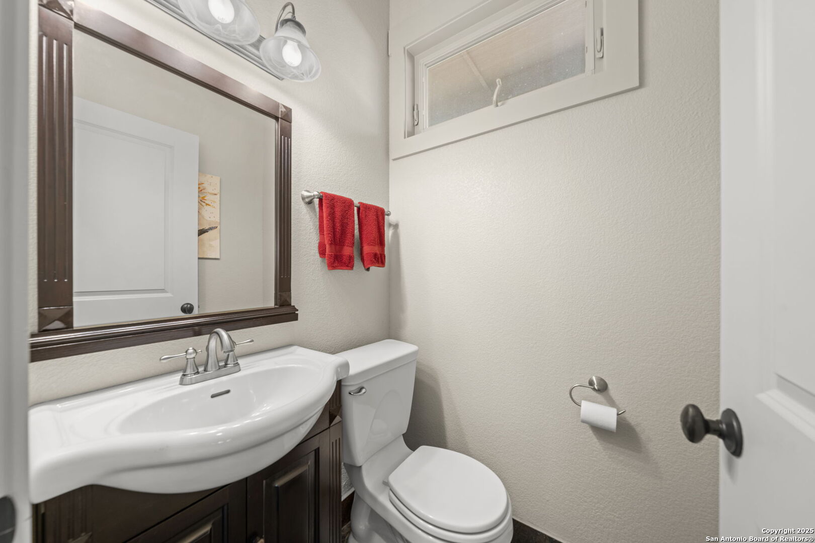 131 Bootlegger Lane North Kerrville, TX 78028 - Photo 39 of 50 a bathroom with a sink a toilet and mirror