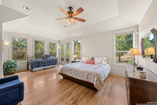 a large bathroom with a double vanity sink and a mirror