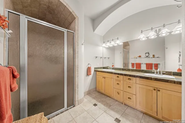 a bedroom with bed and balcony