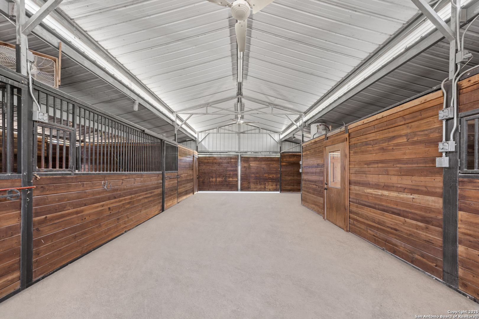 131 Bootlegger Lane North Kerrville, TX 78028 - Photo 48 of 50 a view of water heater room with stairs