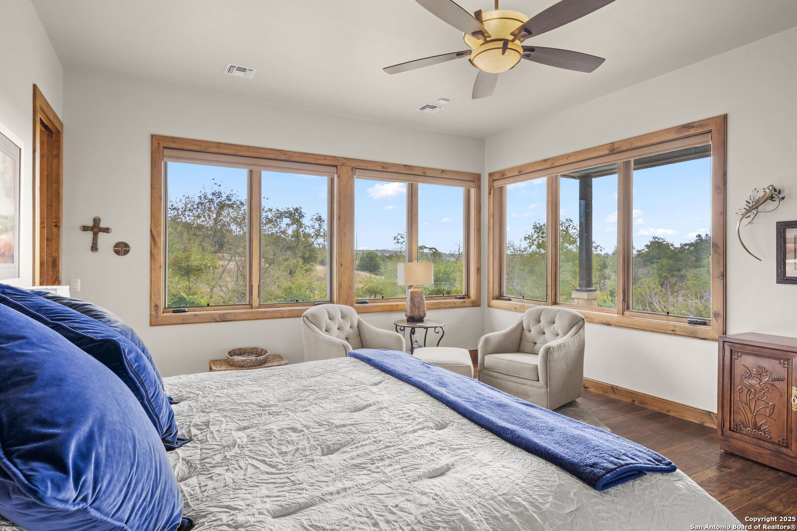 131 Bootlegger Lane North Kerrville, TX 78028 - Photo 6 of 50 a spacious bedroom with a bed and glass walk in closet