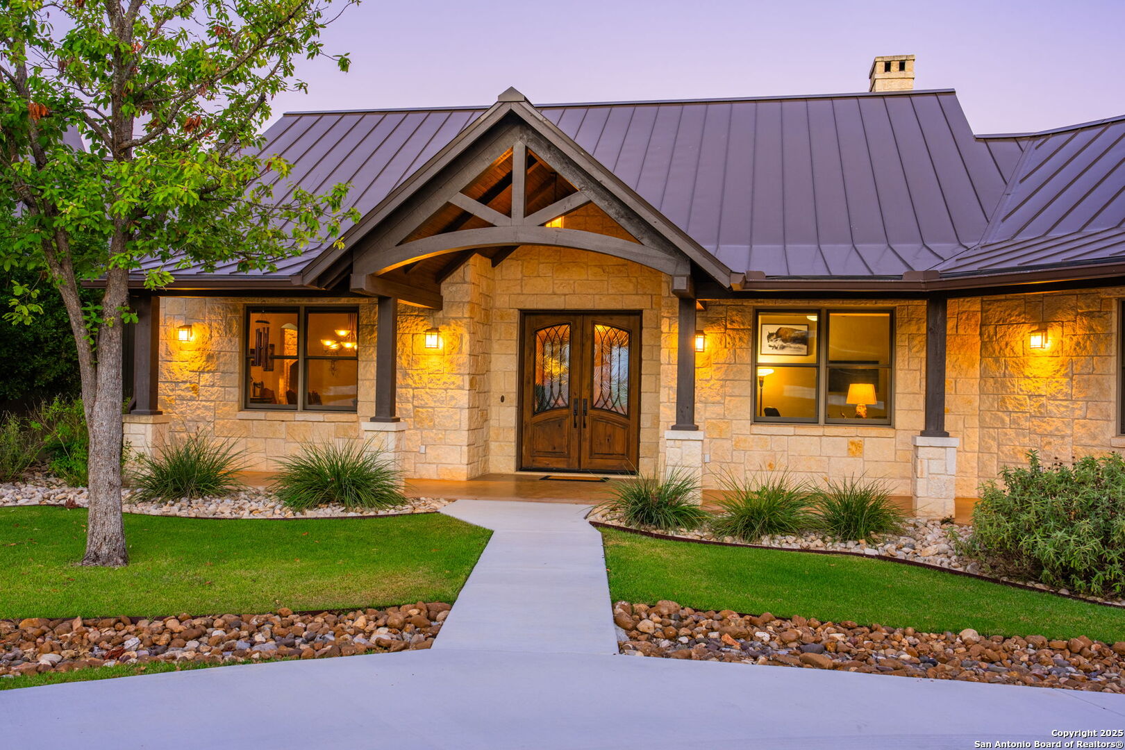 131 Bootlegger Lane North Kerrville, TX 78028 - Photo 9 of 50 a front view of a house with garden
