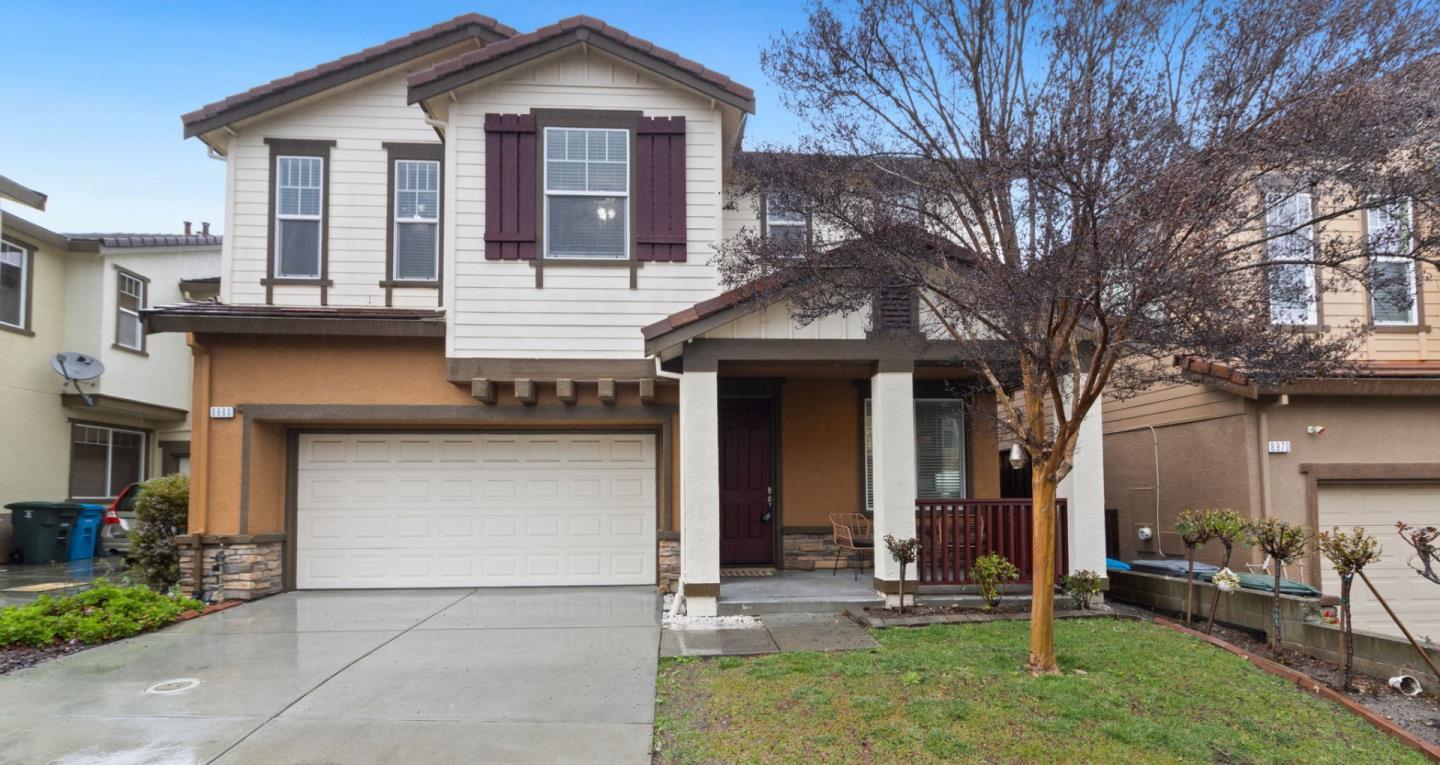 8980 Acorn Way Gilroy, CA 95020 - Photo 1 of 1 a front view of a house with garden