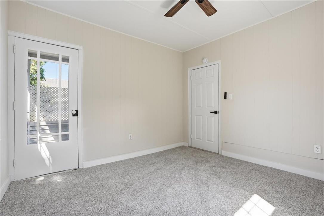 110 Messinger Street Bangor, PA 18013 - Photo 17 of 39 A quiet space with soft carpet, bathed in sunlight from the glass-paned door.