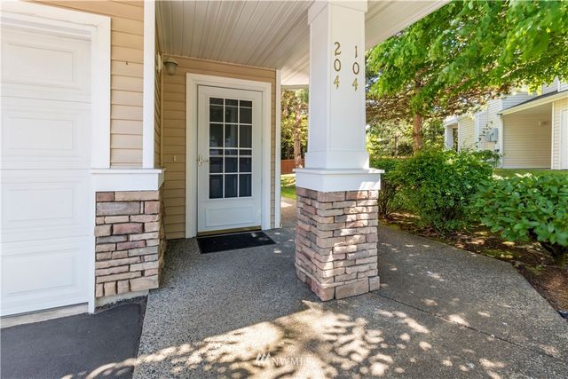 a view of front door of house with stairs