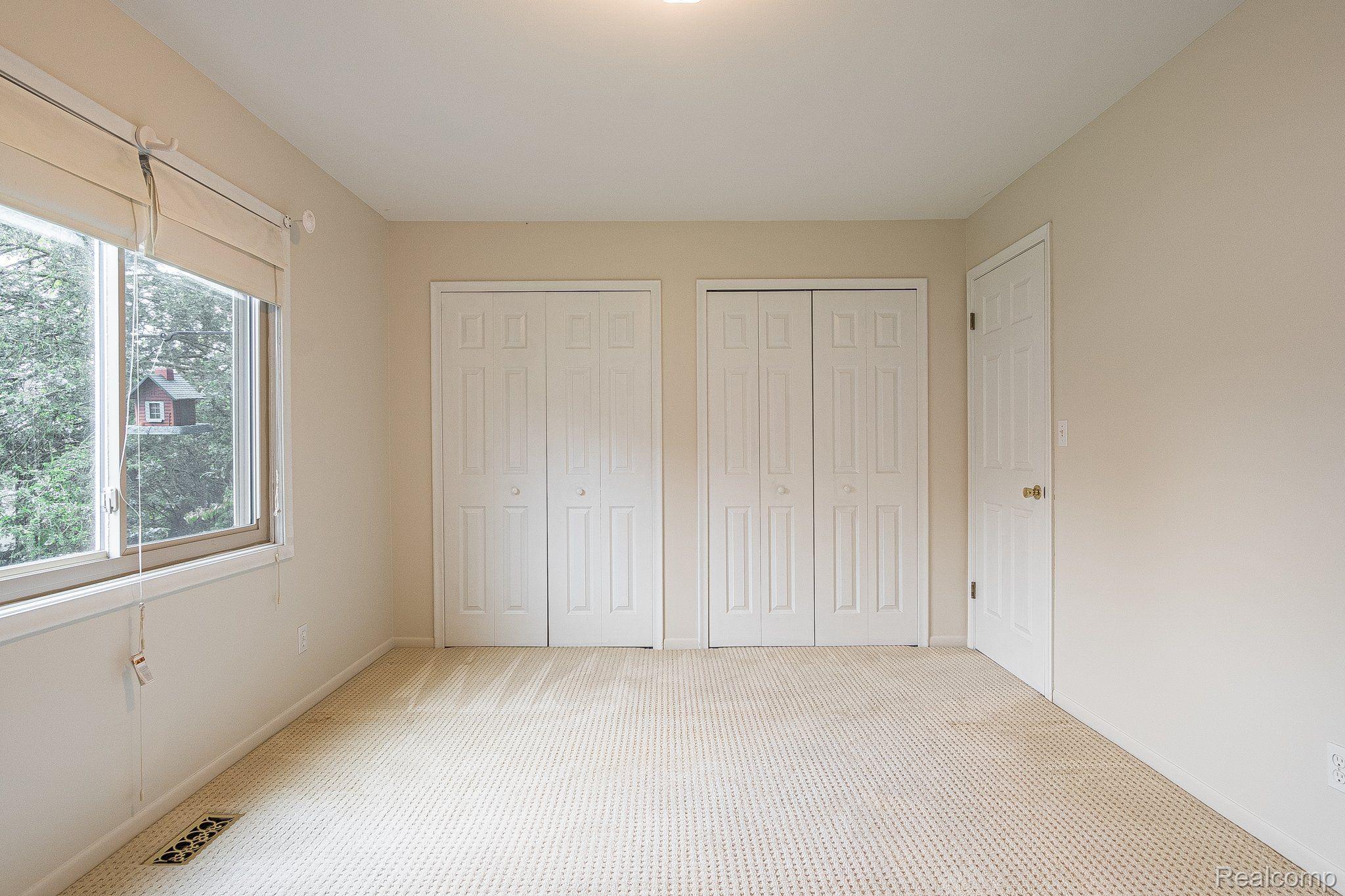 205 George Street Flushing, MI 48433 - Photo 22 of 40 Main floor primary bedroom