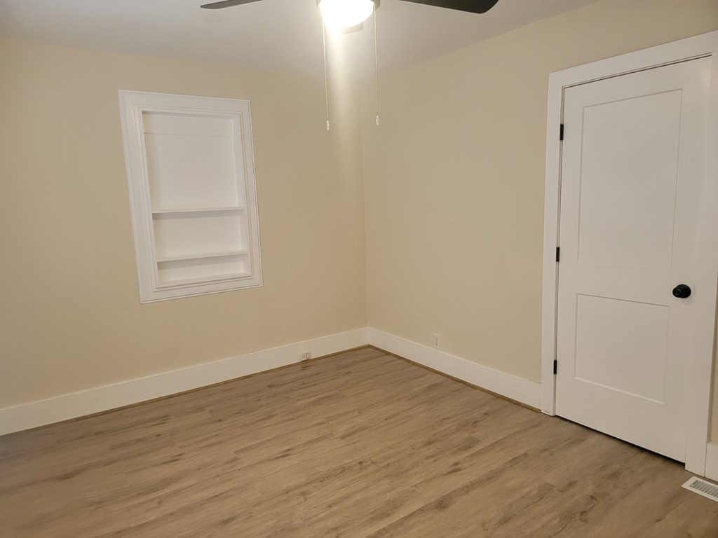 5214 Armour Road Columbus, GA 31904 - Photo 13 of 17 an empty room with wooden floor and closet