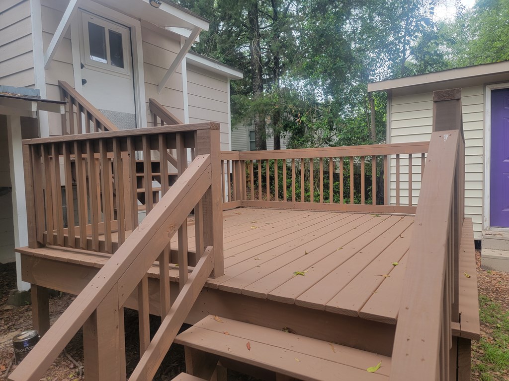 5214 Armour Road Columbus, GA 31904 - Photo 14 of 17 a balcony with wooden floor and stairs
