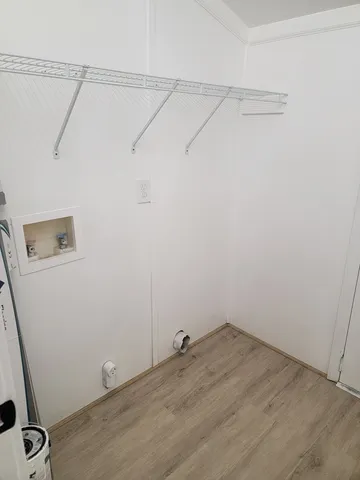 a view of a room with racks on the wall