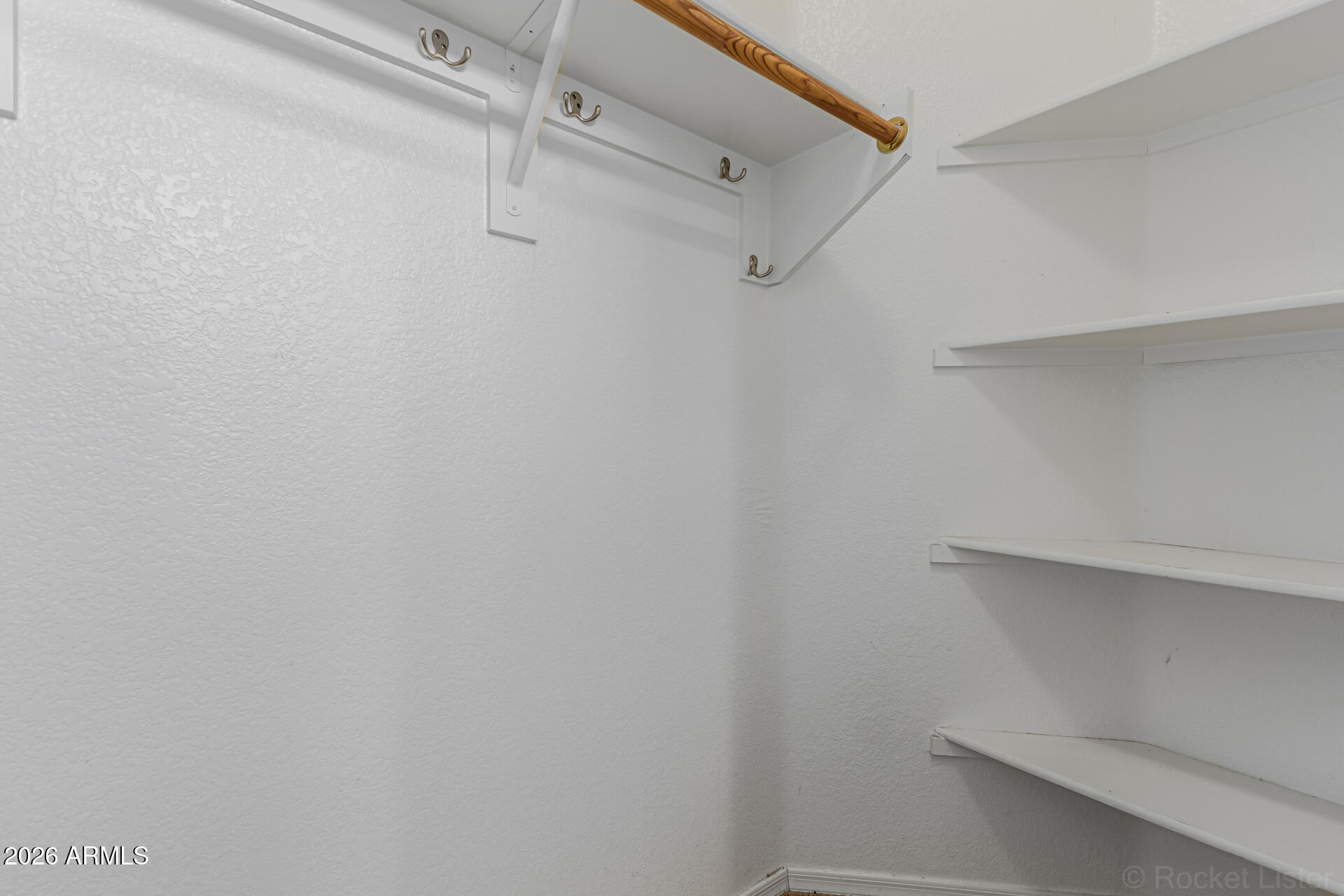 462 North 168th Lane Goodyear, AZ 85338 - Photo 13 of 32 a view of a room with shelf