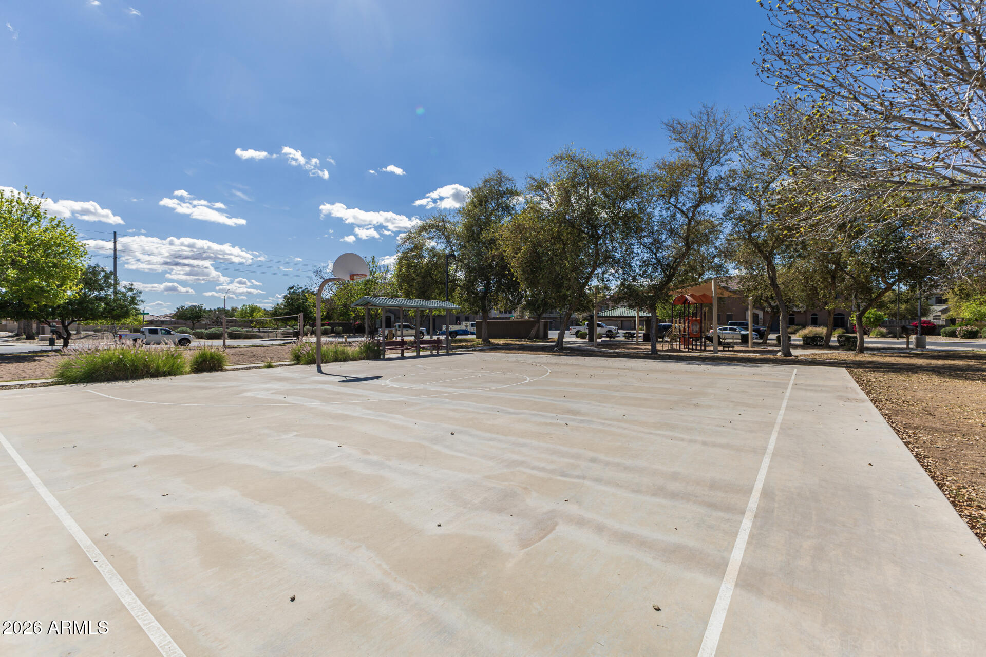 462 North 168th Lane Goodyear, AZ 85338 - Photo 25 of 32 a view of outdoor space with swings and slides