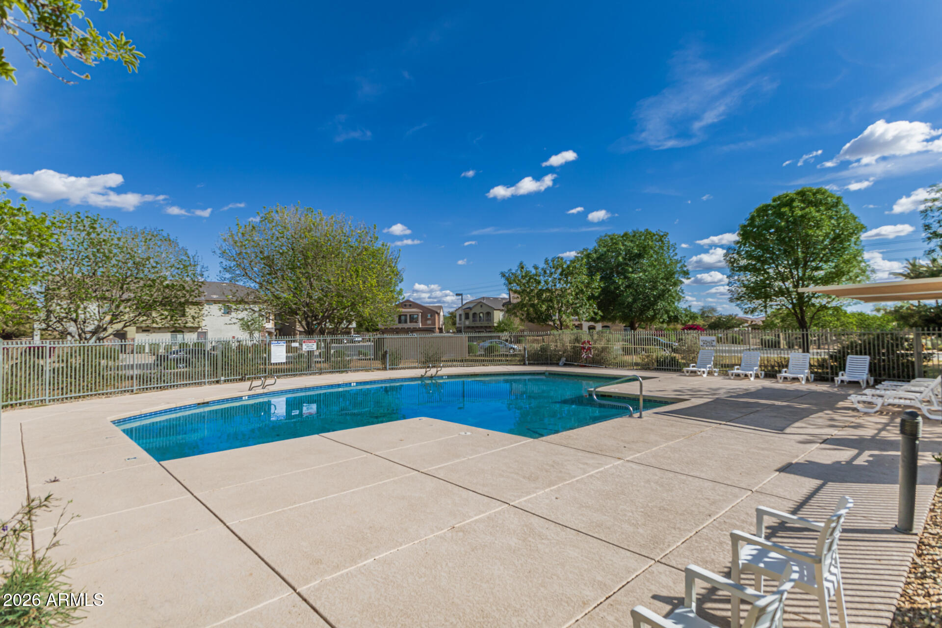 462 North 168th Lane Goodyear, AZ 85338 - Photo 28 of 32 a view of swimming pool outdoor seating