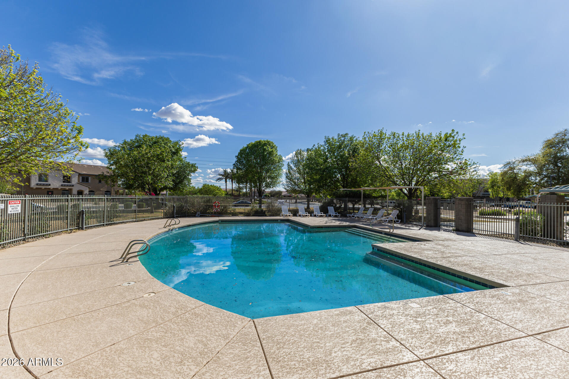 462 North 168th Lane Goodyear, AZ 85338 - Photo 29 of 32 a view of a swimming pool with outdoor seating