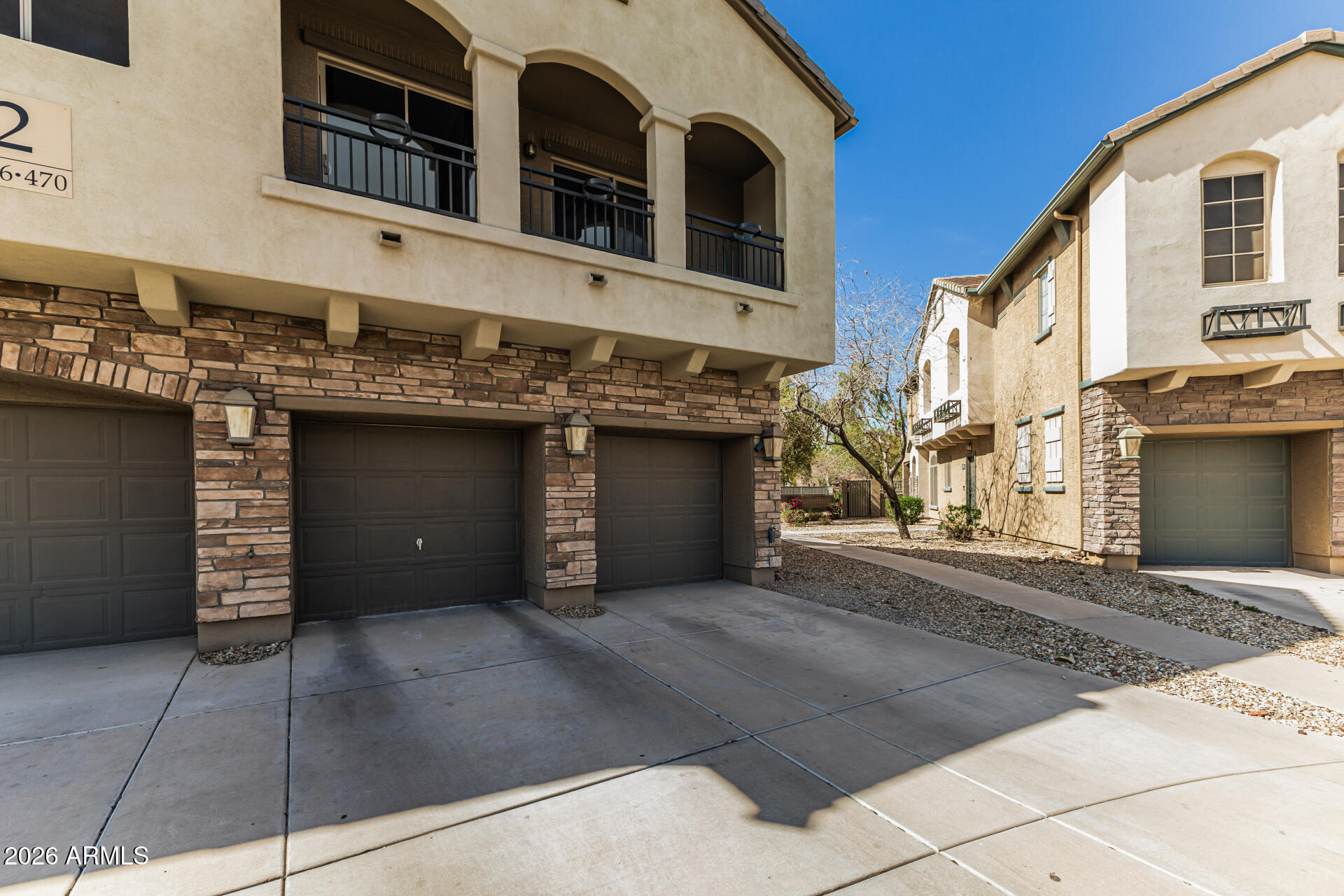 462 North 168th Lane Goodyear, AZ 85338 - Photo 31 of 32 a house view with a outdoor space