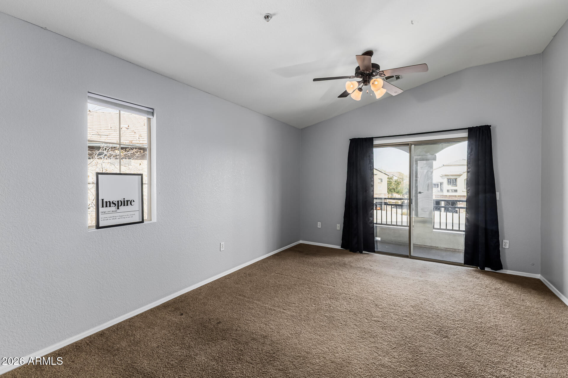 462 North 168th Lane Goodyear, AZ 85338 - Photo 9 of 32 a view of a livingroom with a ceiling fan and window