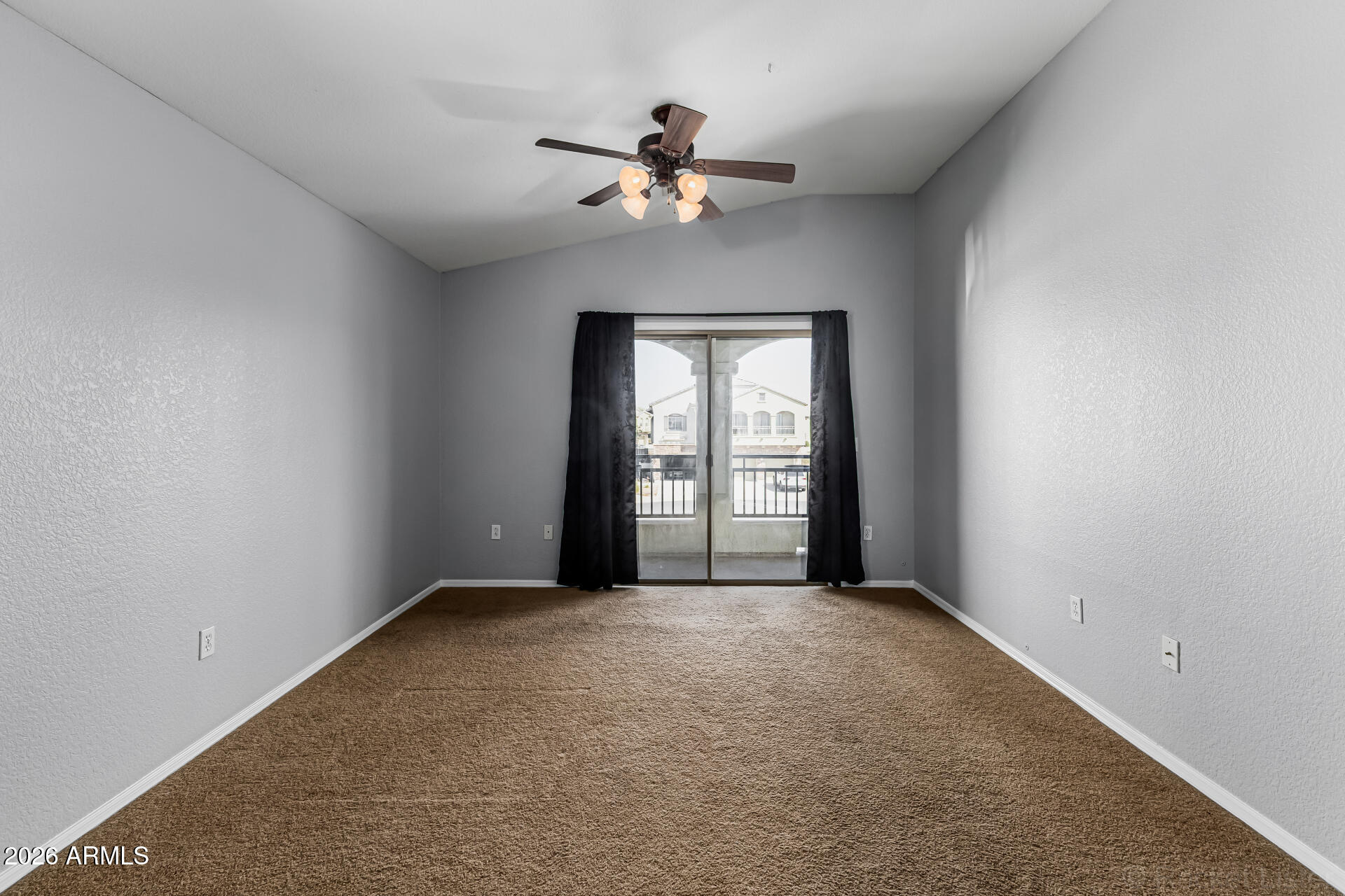 462 North 168th Lane Goodyear, AZ 85338 - Photo 10 of 32 wooden floor in an empty room with a window