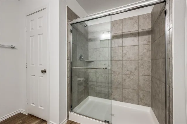 a bathroom with a shower and a bathtub