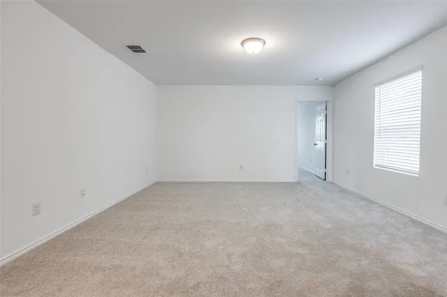 an empty room with a natural light