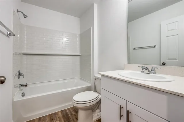 a bathroom with a sink a toilet and a bathtub