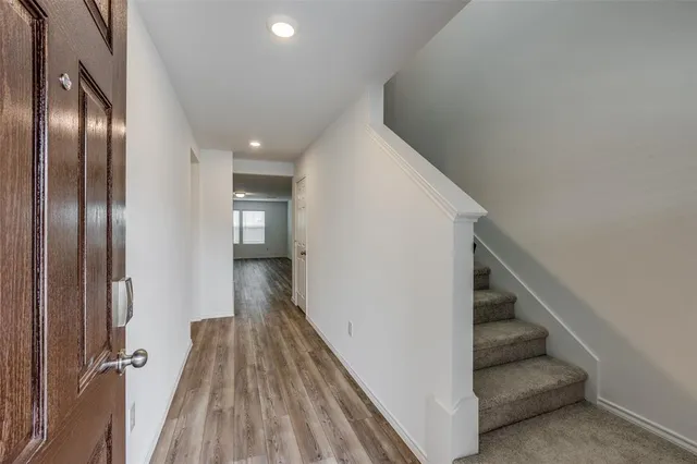 a view of a hallway with entryway