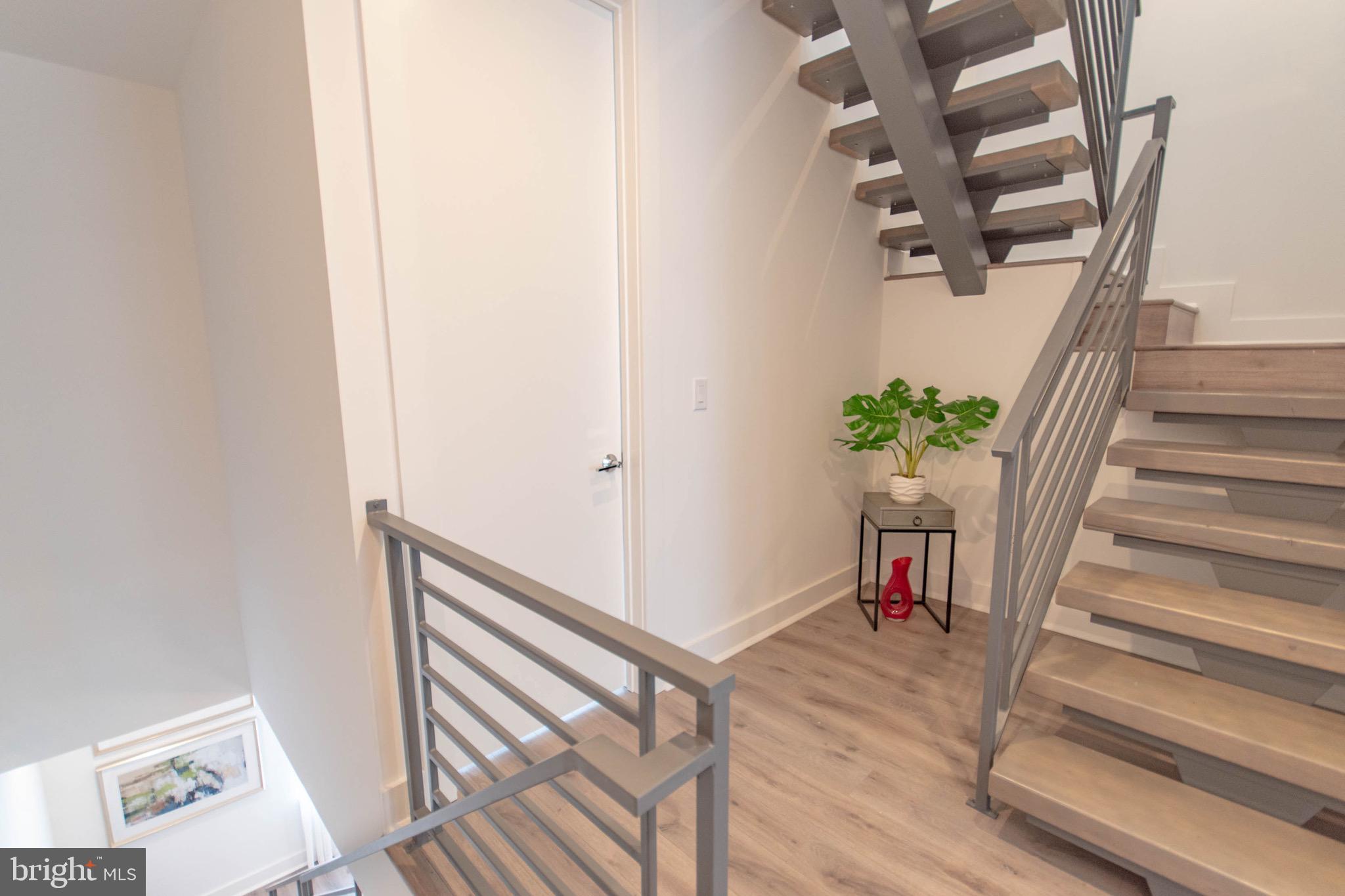 105 Olive Street Philadelphia, PA 19123 - Photo 15 of 36 a view of entryway and hall with wooden floor