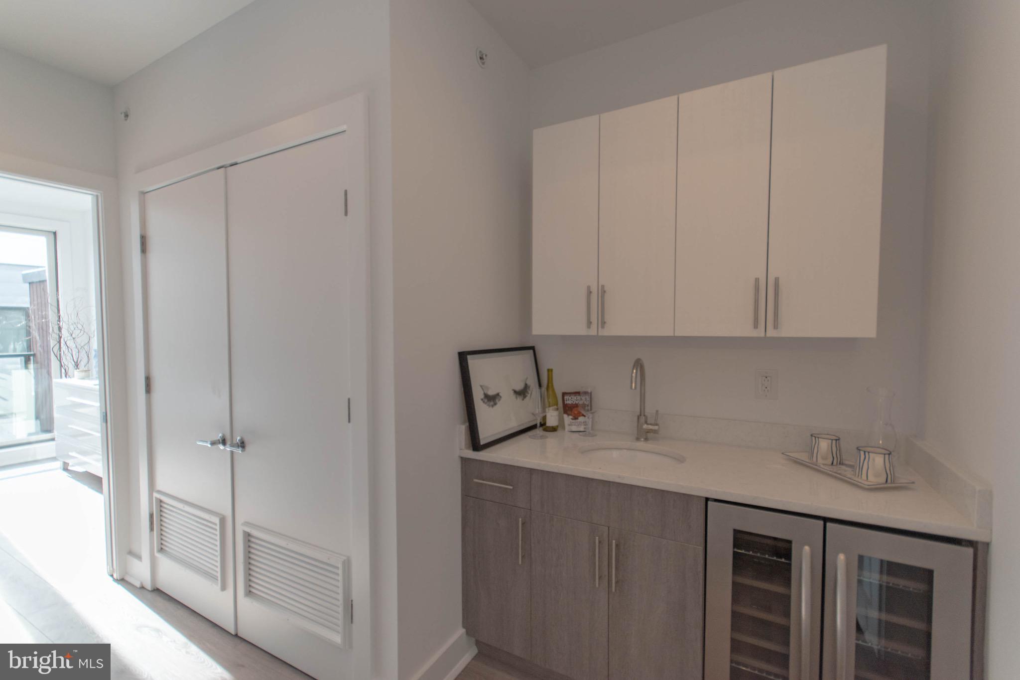 105 Olive Street Philadelphia, PA 19123 - Photo 21 of 36 a bathroom with a sink and a mirror