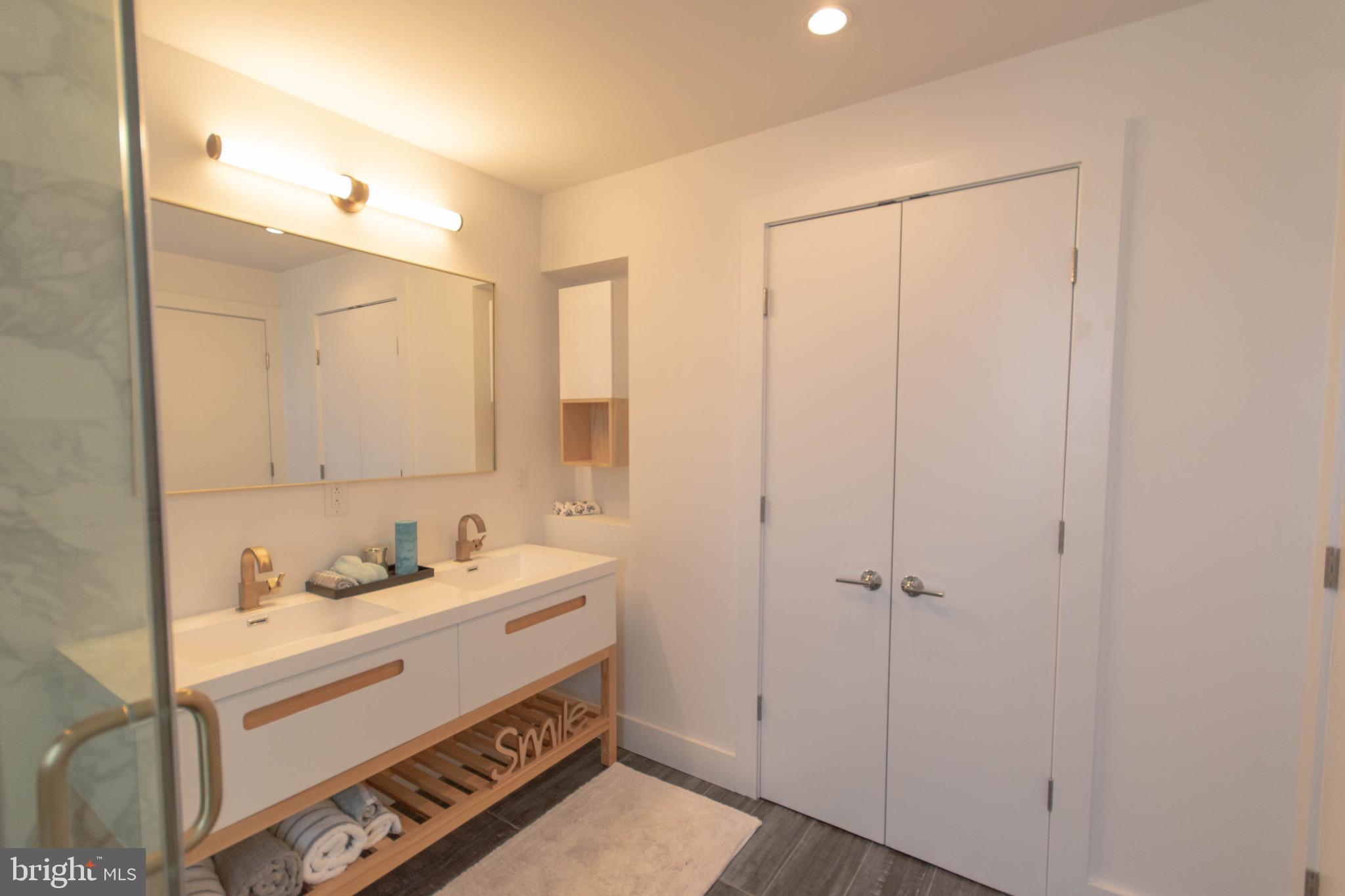 105 Olive Street Philadelphia, PA 19123 - Photo 23 of 36 a bathroom with a sink and a mirror