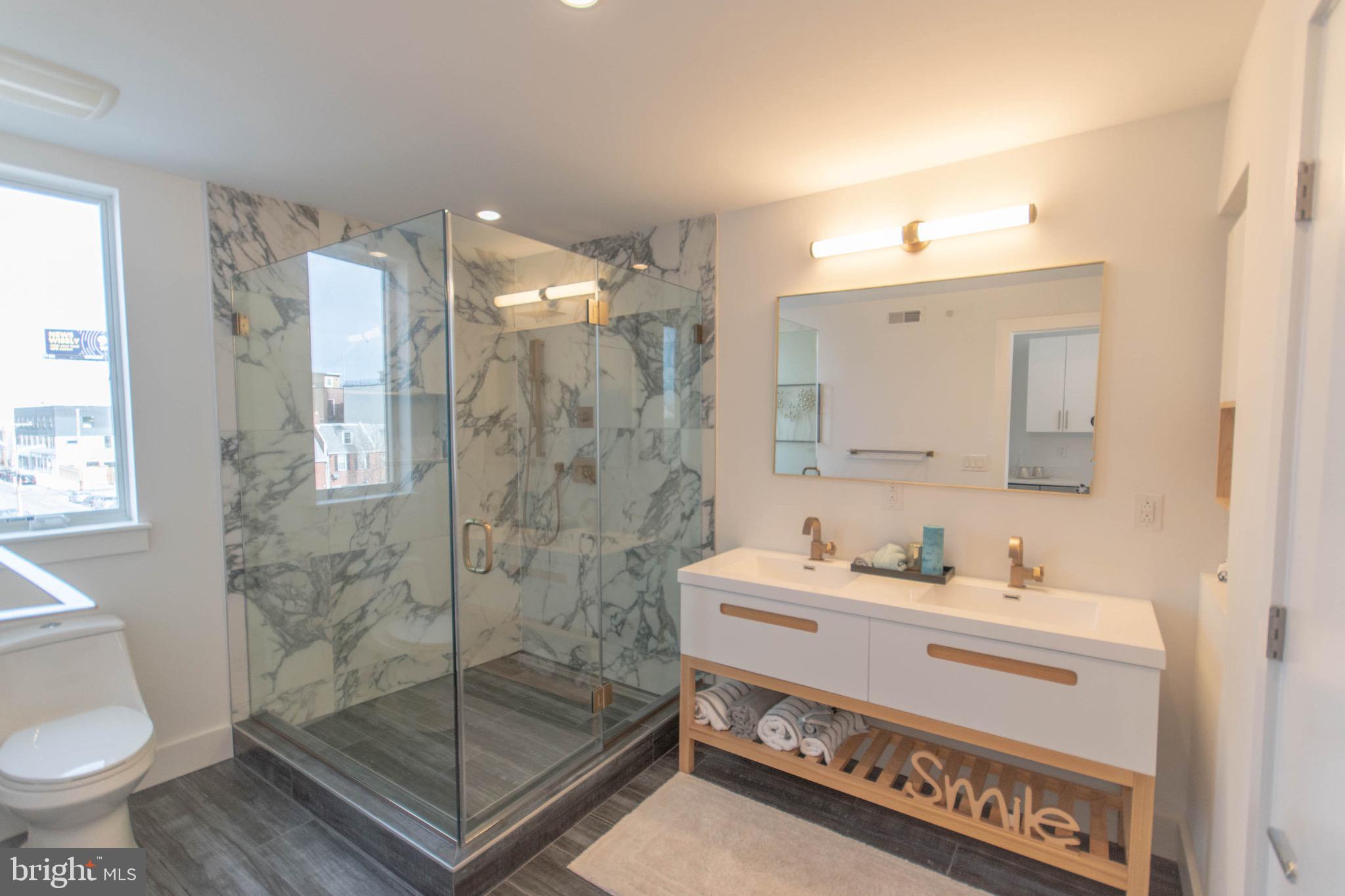 105 Olive Street Philadelphia, PA 19123 - Photo 24 of 36 a bathroom with a sink a toilet and shower