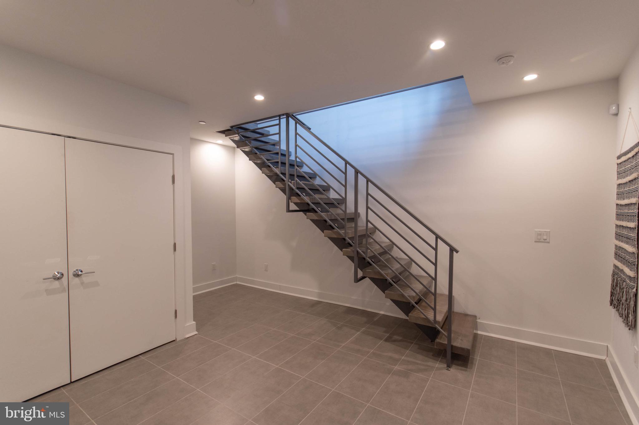 105 Olive Street Philadelphia, PA 19123 - Photo 35 of 36 a view of a hallway with staircase