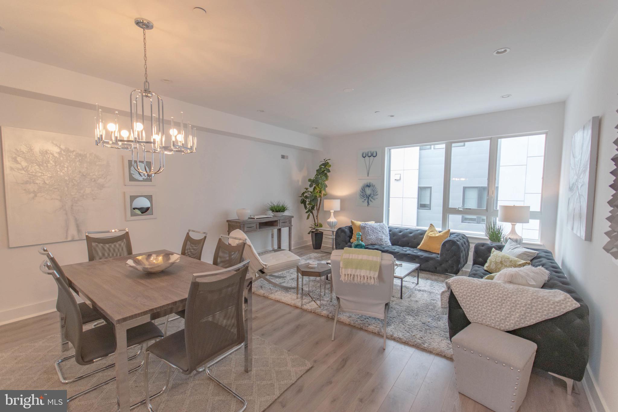 105 Olive Street Philadelphia, PA 19123 - Photo 5 of 36 a living room with furniture and a chandelier