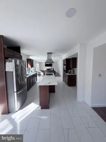 a room with a dresser and a window