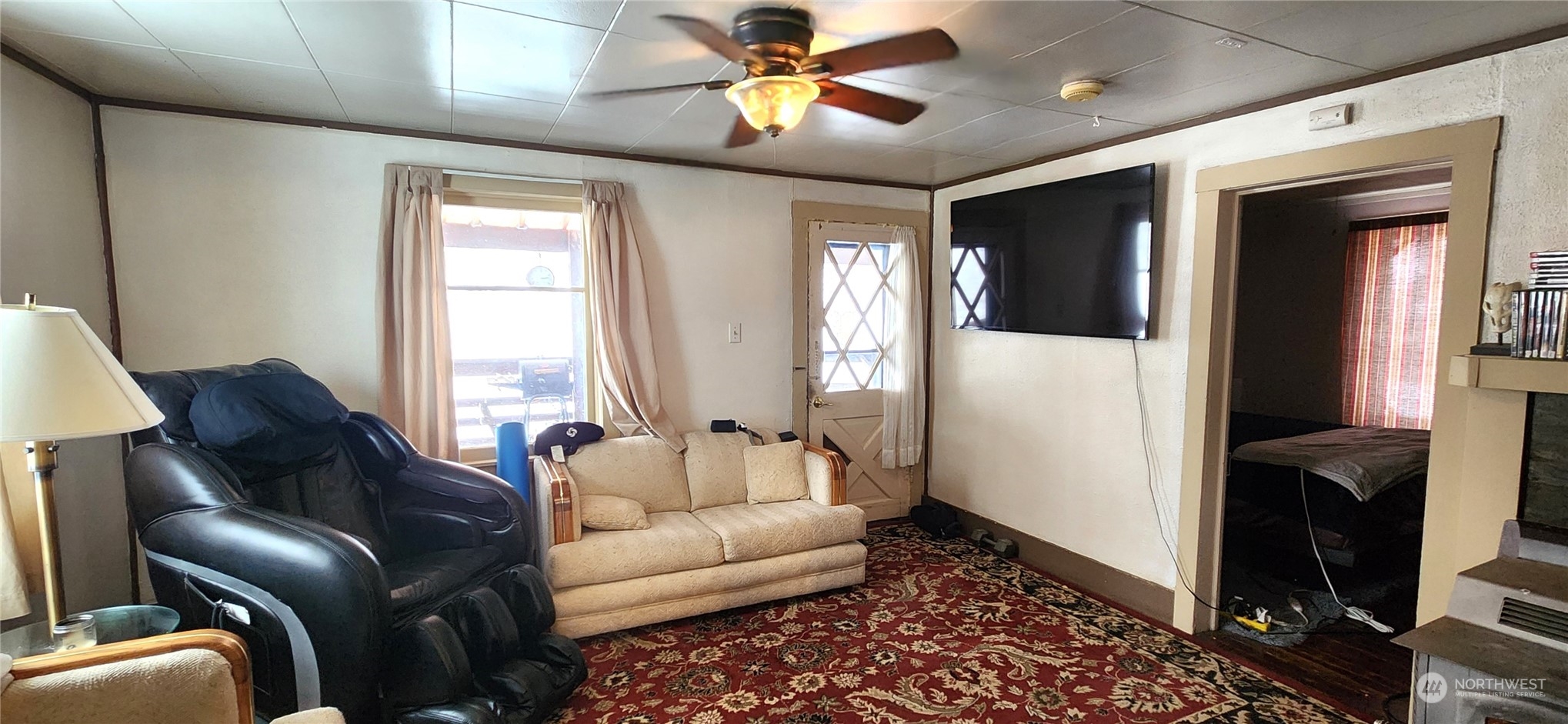 50 Klondike Road Republic, WA 99166 - Photo 4 of 18 a living room with furniture and a flat screen tv