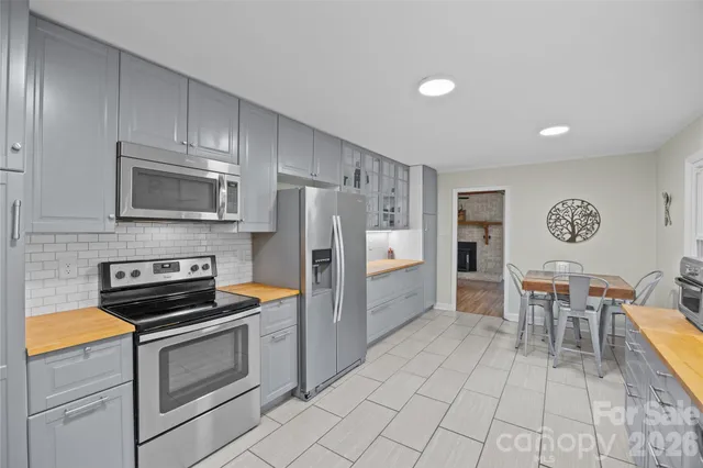 a spacious bathroom with a sink and a large mirror