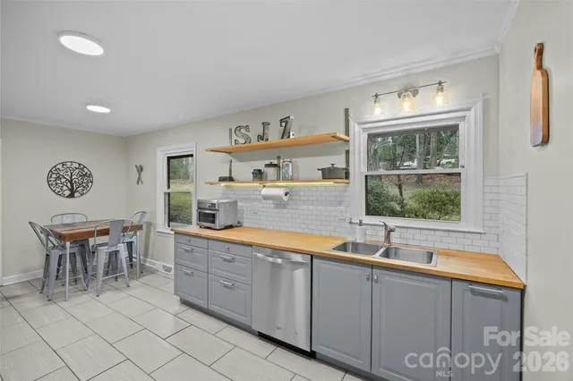 a kitchen with granite countertop cabinets and furniture