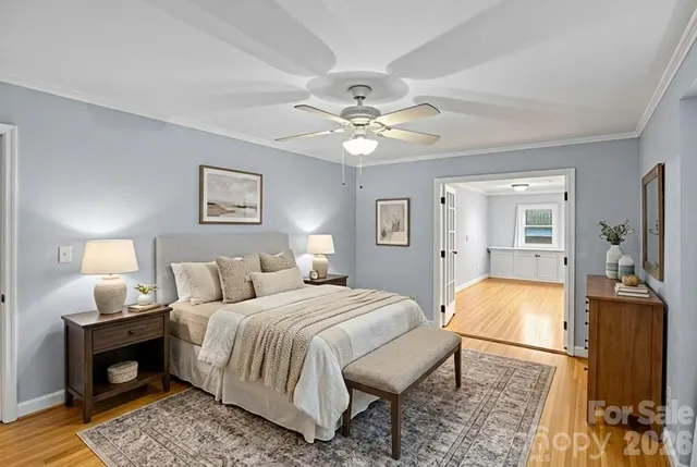 a bed room with a bed and a chair