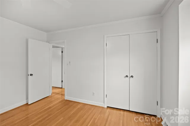 a front view of a brick house with a yard