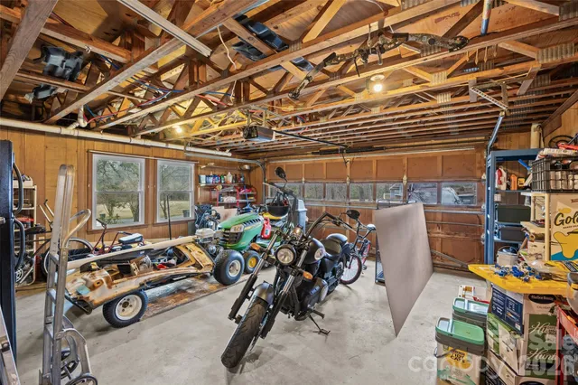a view of a house with a yard and garage