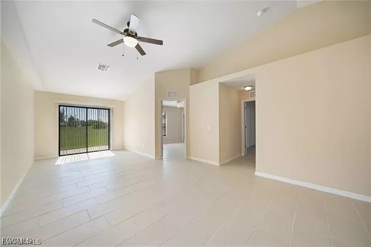 1114 Southwest 15th Place Cape Coral, FL 33991 - Photo 3 of 10 an empty room with fan and windows
