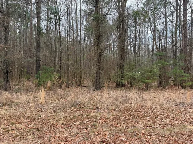 a view of outdoor space with wooden fence